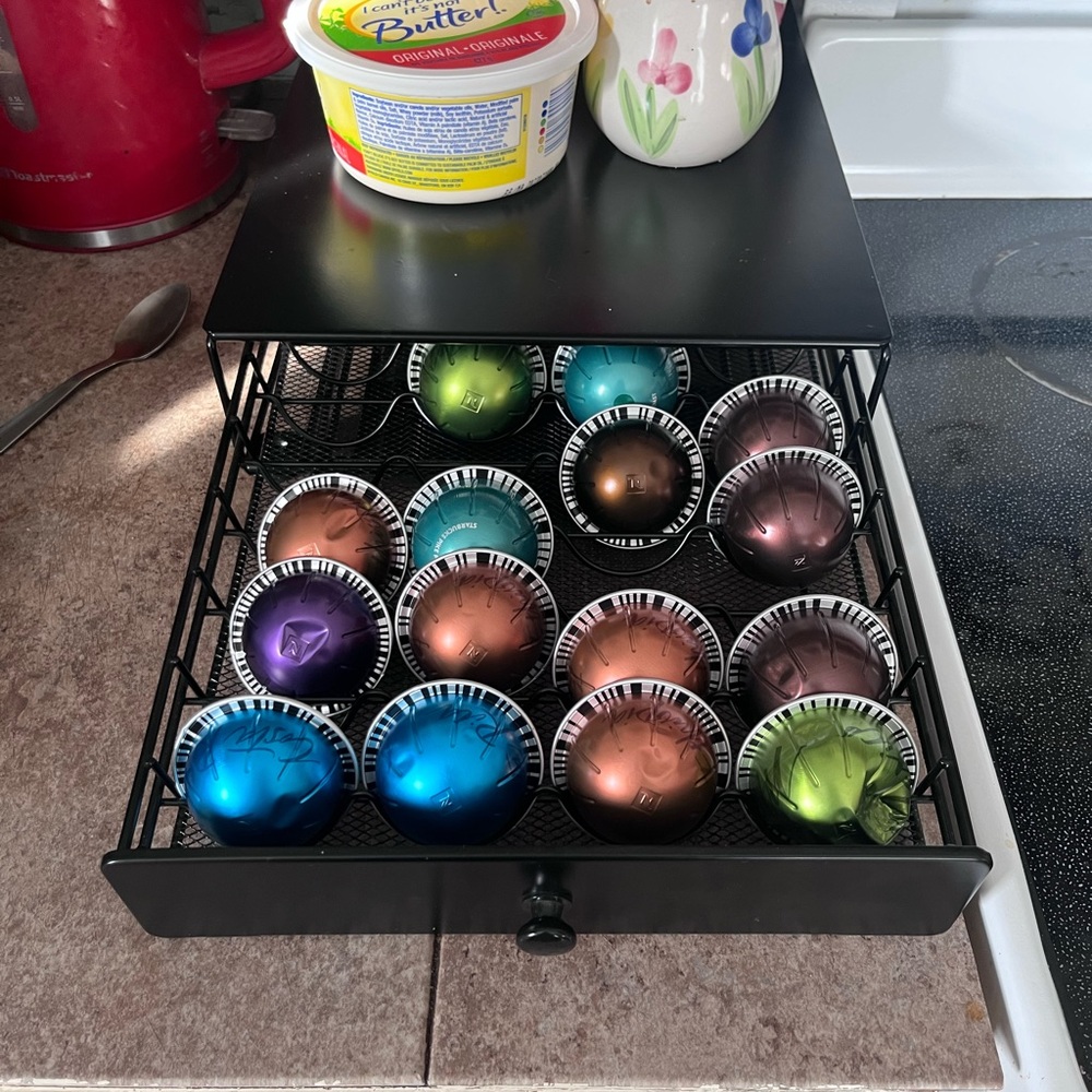 Espresso machine with tray and whatever pods are left upon purchase.
